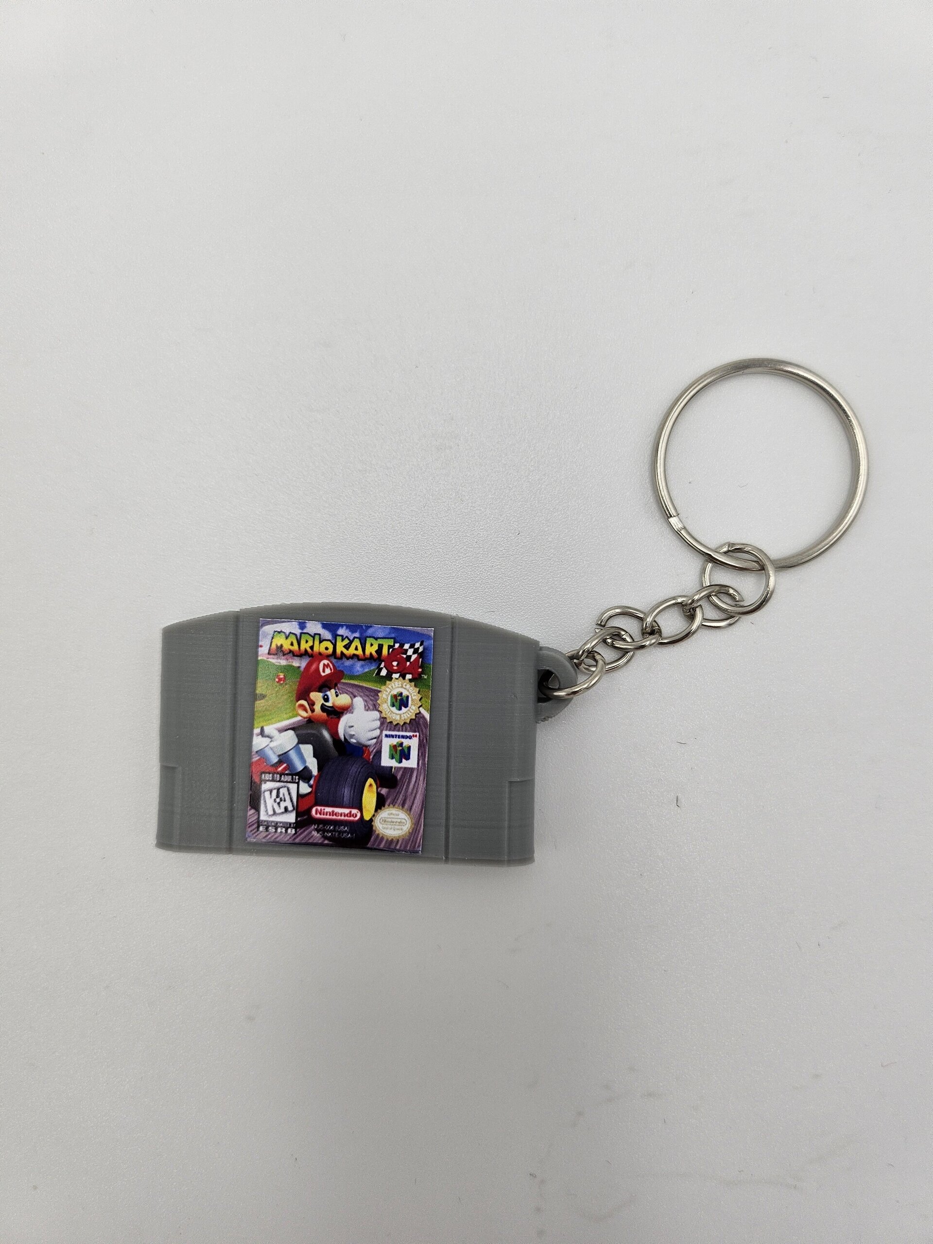 LLAVERO CARTUCHO VIDEOJUEGO NINTENDO 64 - 2